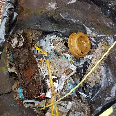 two 35 lt. bags full of paper & plastic